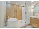 Contemporary bathroom featuring a soaking tub, glass shower, and stylish vanity at 3326 Winterfield Pl, Charlotte, NC 28205
