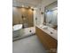 Modern bathroom featuring glass shower, soaking tub, double vanity, and contemporary fixtures at 3326 Winterfield Pl, Charlotte, NC 28205