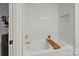 Beautiful bathroom showcasing tub with white tile surround at 3326 Winterfield Pl, Charlotte, NC 28205