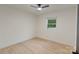 A bright bedroom with light wood floors, a ceiling fan, and a window at 3326 Winterfield Pl, Charlotte, NC 28205