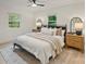 Serene bedroom with neutral tones, a ceiling fan, and views of the outdoor scenery at 3326 Winterfield Pl, Charlotte, NC 28205