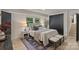 Comfortable bedroom with neutral decor, stylish rug, and closet at 3326 Winterfield Pl, Charlotte, NC 28205