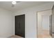 Bedroom view showcasing the closet with a modern, dark door and interior hallway entrance at 3326 Winterfield Pl, Charlotte, NC 28205