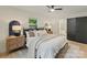 Stylish bedroom featuring neutral decor, a ceiling fan, and an open ensuite bathroom at 3326 Winterfield Pl, Charlotte, NC 28205