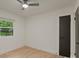 Neutral bedroom featuring wood floors, a ceiling fan, natural light and dark colored doors at 3326 Winterfield Pl, Charlotte, NC 28205