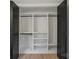Spacious walk-in closet with custom shelving and hanging rods for optimal storage at 3326 Winterfield Pl, Charlotte, NC 28205