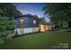 Charming two-story home with a landscaped yard and a freshly painted black and white exterior at 3326 Winterfield Pl, Charlotte, NC 28205