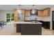 Open-concept kitchen featuring modern appliances, a kitchen island, and sleek design at 3326 Winterfield Pl, Charlotte, NC 28205