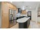 Modern kitchen with stainless steel appliances, island sink, and stylish pendant lighting at 3326 Winterfield Pl, Charlotte, NC 28205