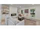 Contemporary living room featuring a sleek fireplace, white sofas, and large windows at 3326 Winterfield Pl, Charlotte, NC 28205