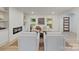 Cozy living room with a modern fireplace, comfortable seating, and lots of natural light at 3326 Winterfield Pl, Charlotte, NC 28205