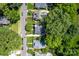 Aerial view of a tree-lined neighborhood highlighting a home's roof and surrounding greenery at 361 5Th Nw St, Hickory, NC 28601