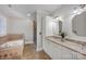 Elegant bathroom featuring double sinks, a soaking tub, and a separate glass-enclosed shower at 361 5Th Nw St, Hickory, NC 28601