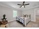 Comfortable bedroom with a ceiling fan and a sunlit window, perfect for a guest or  at 361 5Th Nw St, Hickory, NC 28601