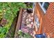 Outdoor wooden deck with furniture, grill, and brick wall, perfect for entertaining and relaxation at 361 5Th Nw St, Hickory, NC 28601