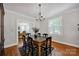 Dining room with hardwood floors, a chandelier, and direct access to the Living Room at 361 5Th Nw St, Hickory, NC 28601