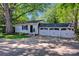 Exterior view showcasing a white detached garage with black accents, and a concrete driveway at 361 5Th Nw St, Hickory, NC 28601