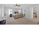 Bright main bedroom with large windows, ceiling fan, and access to ensuite bathroom at 361 5Th Nw St, Hickory, NC 28601
