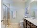 Modern bathroom with a glass shower, sleek vanity, and neutral tones at 4060 Zilker Park Dr, Charlotte, NC 28217