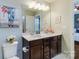 Bathroom with double vanity, framed mirror, and modern lighting fixtures at 4060 Zilker Park Dr, Charlotte, NC 28217