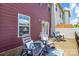 Charming deck with outdoor seating, pillows, and stylish decor at 4060 Zilker Park Dr, Charlotte, NC 28217