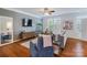 Comfortable living room with hardwood floors, neutral paint and a large TV at 4060 Zilker Park Dr, Charlotte, NC 28217