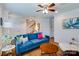 Bright living room boasts hardwood floors, ceiling fan and a cozy seating area at 4060 Zilker Park Dr, Charlotte, NC 28217