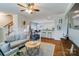 Open-concept living room with hardwood floors, neutral decor, and modern furniture at 4060 Zilker Park Dr, Charlotte, NC 28217