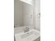 Bathroom with a large mirror, sink, and modern fixtures in a neutral color palette at 420 E 16Th St, Charlotte, NC 28206