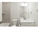 Bright bathroom featuring a single sink, modern fixtures, and gray tile backsplash in the shower/tub area at 420 E 16Th St, Charlotte, NC 28206