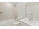 Clean bathroom design with tub-shower, single sink vanity, and modern fixtures at 420 E 16Th St, Charlotte, NC 28206