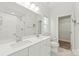 Bathroom featuring double sinks, tile floors, and a large mirror at 420 E 16Th St, Charlotte, NC 28206