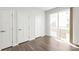 Bedroom features hardwood floors, closet space and sliding door access to outdoor space at 420 E 16Th St, Charlotte, NC 28206