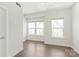 Cozy bedroom with hardwood floors and plenty of natural light coming from the windows at 420 E 16Th St, Charlotte, NC 28206