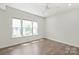 Inviting bedroom featuring three windows that flood the room with natural light and hardwood flooring at 420 E 16Th St, Charlotte, NC 28206