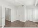 Hardwood floors create warmth in this bedroom with multiple doorways, providing both functionality and style at 420 E 16Th St, Charlotte, NC 28206
