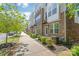 Well-maintained townhomes feature charming walkways and manicured landscaping at 420 E 16Th St, Charlotte, NC 28206