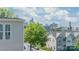 Attractive townhomes with a view of the Charlotte skyline and lush green trees at 420 E 16Th St, Charlotte, NC 28206