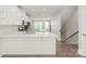 Open-concept kitchen with quartz countertops, stainless steel appliances, and hardwood floors at 420 E 16Th St, Charlotte, NC 28206
