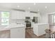 Bright, updated kitchen featuring white cabinets, stainless steel appliances, and a center island at 420 E 16Th St, Charlotte, NC 28206