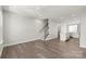 Open-concept living room with hardwood floors, recessed lighting, and staircase access at 420 E 16Th St, Charlotte, NC 28206