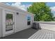 Spacious rooftop deck area with gray composite decking, providing a great outdoor living space at 420 E 16Th St, Charlotte, NC 28206