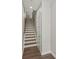 Beautiful wooden staircase with hardwood floors and a crisp white accent door at 420 E 16Th St, Charlotte, NC 28206