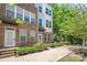 Charming townhome with well-kept landscaping enhance its curb appeal at 420 E 16Th St, Charlotte, NC 28206