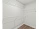 Walk-in closet featuring wire shelving and hardwood floors at 420 E 16Th St, Charlotte, NC 28206