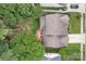 Aerial view of a home with a deck and patio furniture, mature trees, and manicured lawn at 4407 Beauvista Dr, Charlotte, NC 28269