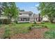 Back exterior with deck and screened-in porch at 4407 Beauvista Dr, Charlotte, NC 28269