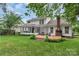 Back exterior with deck and screened-in porch at 4407 Beauvista Dr, Charlotte, NC 28269