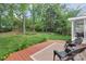 Backyard featuring a wood deck, outdoor seating, and lush landscaping at 4407 Beauvista Dr, Charlotte, NC 28269