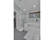 Bright bathroom with soaking tub, glass shower, and neutral decor at 4407 Beauvista Dr, Charlotte, NC 28269